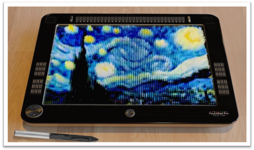 Display of TouchPad Pro with Starry Night painting displayed. The tablet resembles a large iPad turned on its side horizontally. The majority of the surface is made up of over 5000 pins that raise and lower to different heights to form tactile images, multiple lines of braille, or a touch-sensitive Braille keyboard. It is called a tactile and visual display because the pins contain characteristics that make them light up in various colors. Pictured drawing a bright blue line on the display is an electronically connected stylus, resembling a fat pen. Buttons on the stylus allow it to change instantly from drawing to erasing and may have other functions like shape-making. Above the display is a full line of refreshable braille cells like that of a BrailleNote. To either side of the line of braille cells are stereo speakers. Above the tactile display and line of braille, at 12 o'clock is a front-facing multi-Lens 3D camera and microphone. At 6 o'clock, below the display, is a home button and power button. In the left-hand corner is scrolling and selecting the device. To the left side of the display are 9 buttons with refreshable Braille indicators that can serve different functions.